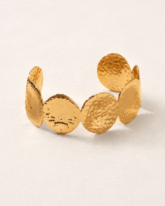 Brazalete Uma dorado con cinco discos martelé